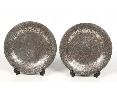 Two fine 19th century middle Eastern copper dishes with silver overlay decoration. With fluted rims, decorated with scrolling