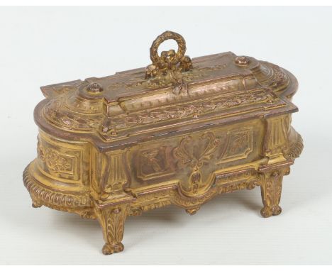 A 19th century French gilt metal casket with padded silk lined interior and raised on bracket feet adorned with anthemia, 17c
