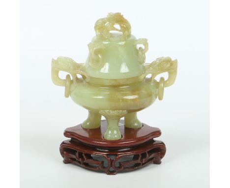 A 20th century Chinese jade urn and cover raised on a wooden plinth, 19.5cm (3).  Condition Report. To be used as a guide onl