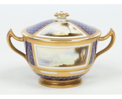 A Royal Worcester twin handled bowl and cover by Harry Davis. Ground in cobalt blue with gilt sprigs and banded compartments 