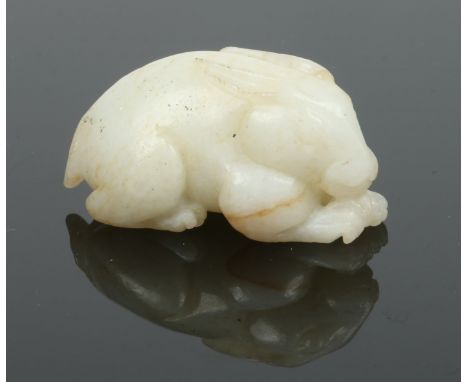 A Chinese carved white jade model of a crouching hare, 5.25cm.  Condition Report. To be used as a guide only. Good condition.
