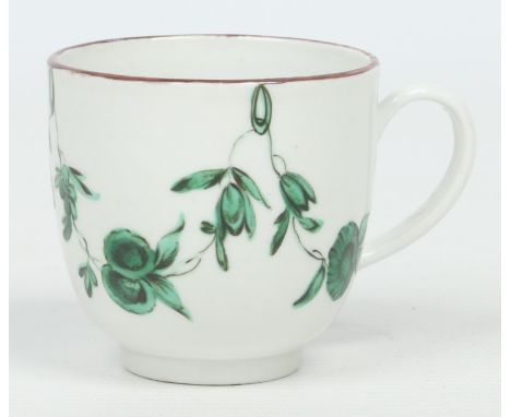 A good Bristol coffee cup with plain loop handle. With a brown line rim and painted tones of green enamel with swags of flowe
