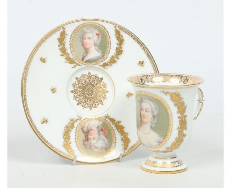 A 20th century Sevres cabinet cup and saucer. With raised tooled gilding and enamelled with three portraits of ladies. Painte