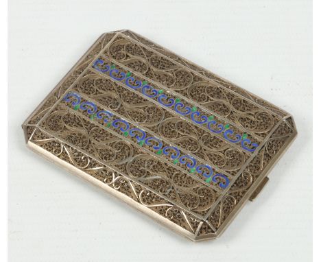 An Indian white metal filigree cigarette case with champleve enamel highlights, 8.5cm.  Condition Report. To be used as a gui