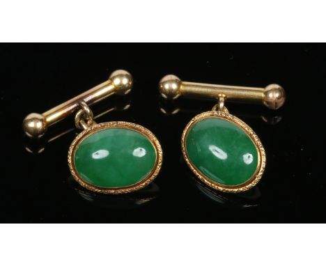A pair of Chinese gold mounted spinach jade cufflinks, 9.17 grams gross weight.  Condition Report. To be used as a guide only