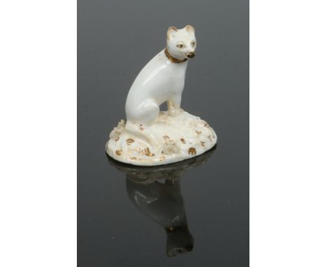 A small Rockingham model of a seated fox looking to its right. Left mostly in the white with its muzzle and eyes picked out i