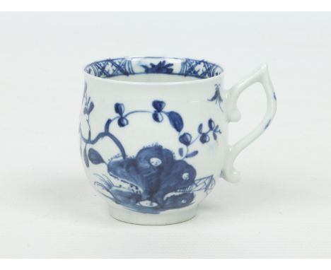 A Worcester bell shaped coffee cup with wishbone handle. Painted in underglaze blue with the Warbler pattern. Workman's mark 