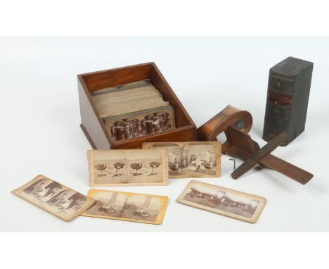 A Victorian stereoscope viewer and a large collection of cards. A boxed set; The Japanese Russian War through the Stereoscope