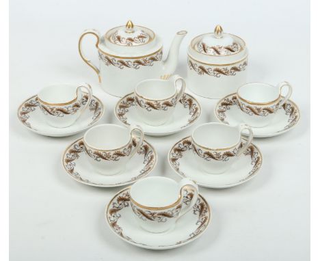 An early 20th century Furstenberg six place part tea / coffee service. Decorated with gilt bands and trailing borders of autu