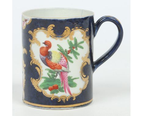 A Worcester mug with grooved strap handle. Scale blue ground and with gilt cartouches containing fancy birds, butterflies and