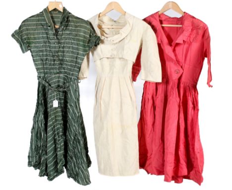Three vintage dresses. Comprising a pink taffeta dress with 3/4 length sleeves, a button front and a pleated skirt, L107cm x 