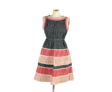 A vintage 1950s Lo Roco dress. Constructed of tightly pleated fabric strung into pink and grey stripes, sleeveless with a sas