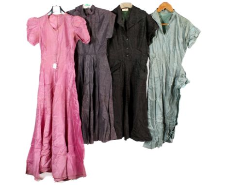 Four vintage dresses. Comprising a Westaways black taffeta dress with green details, having buttons down the front and a pepl
