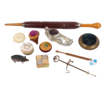 An assortment of Victorian and later sewing tools. Including a turned wooden knitting needle case decorated with flowers, L32