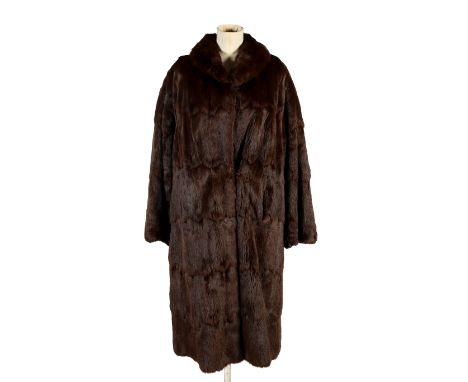 A vintage light brown mink fur coat. With slip pockets and a brown silk lining, L101cm x chest W61cm