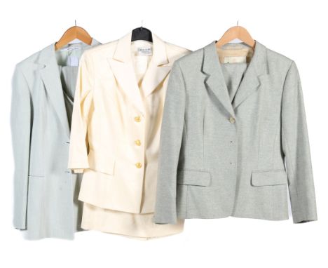 Three ladies designer suits. Comprising a Dusk Frank Usher jacket and skirt constructed of a cream fabric with woven floral d