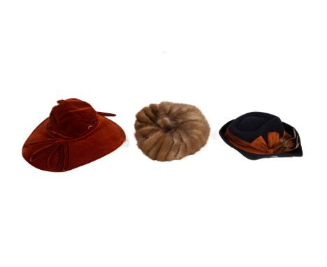 Three vintage ladies hats. Comprising a mink fur hat with cream lining, a Swan & Stone blue felt hat with a brown ribbon and 