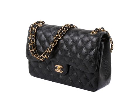 A Chanel Jumbo Classic double flap handbag. Featuring a black quilted caviar leather exterior with polished silver-tone hardw