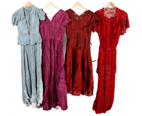 Four vintage formal dresses. Comprising a red lace slip with an embellished belt and bolero, L140cm x chest W45cm, a blue dre