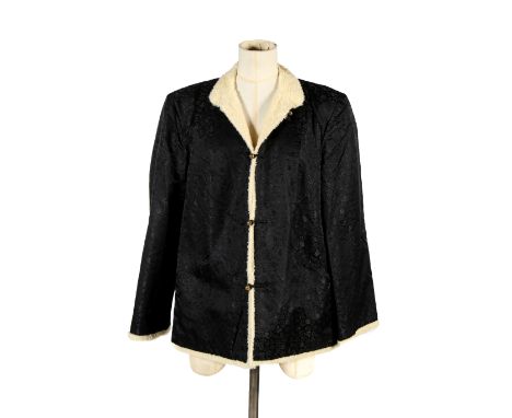 A vintage oriental black brocade jacket. Having button ties, decorated with Archaic vases and Lingzhi, cream woollen lining, 