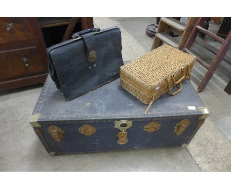 A travel trunk, wicker sewing basket and a Gladstone style bag