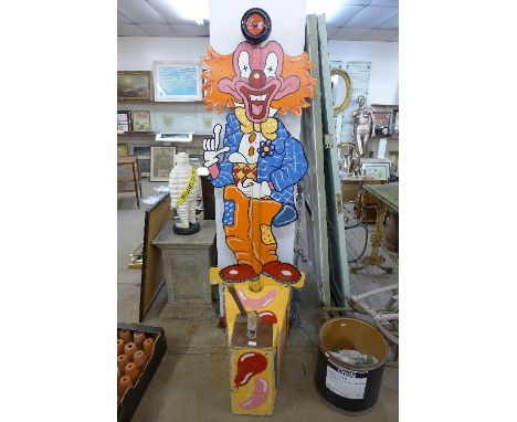A vintage fairground clown test your strength game