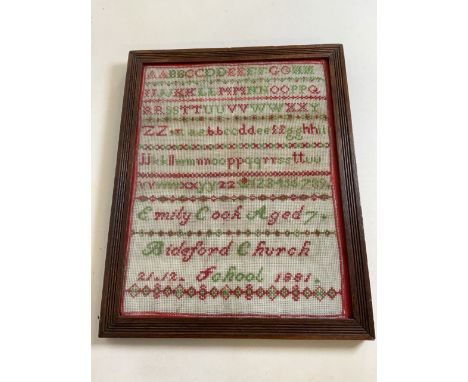 A cross stitch and tapestry sampler dating from 1881 by Emily Cook aged 7 W:30cm x H:39cm actual sampler dimensions 