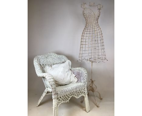 A wire mannequin also with a painted wicker chair with cushion 