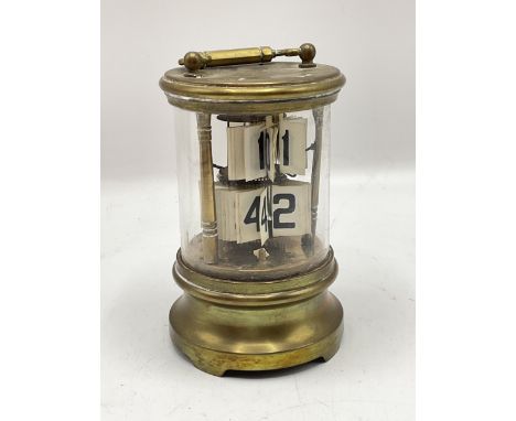 Late 19th century ticket or flip-dial clock. AF condition, the case and mechanism not secured. Brass case with bottom winder,