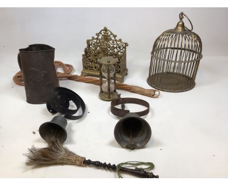 A vintage brass bird cage, an ornate letter rack, two house hold bells, a Heart shaped embossed copper jug and other items 