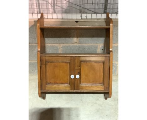 A small antique pine wall hanging cupboard with ceramic handles.W:66cm x D:24cm x H:87cm
