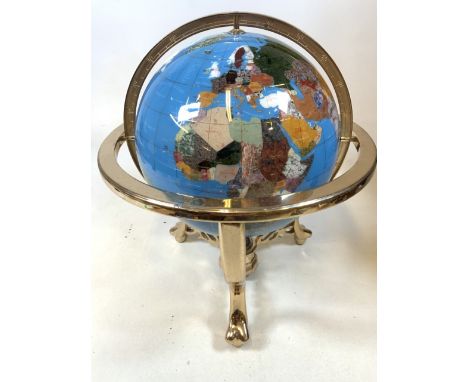 A gem stone globe on gilt stand. H:50cm