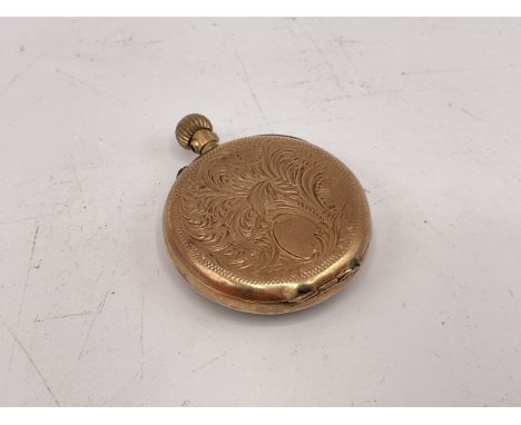 Small ladies pocket watch set within a 9 carat gold case, possibly early 20th century. Gilt finished dial with engraved patte