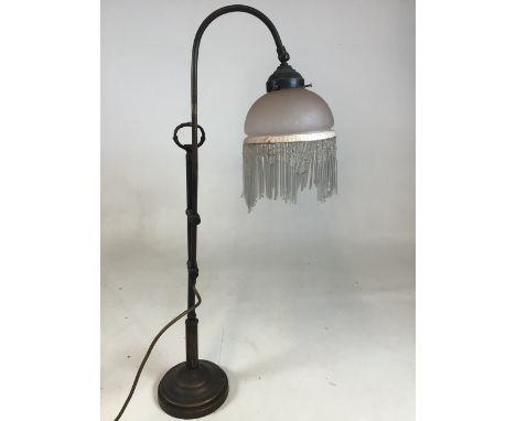 A vintage adjustable lamp with a glass beaded shade H:66cm Extends to 77cm high