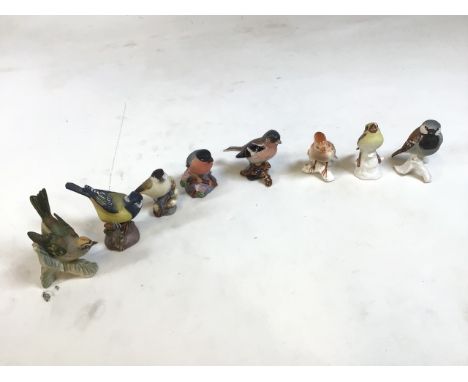 8 ceramic bird figures, from Royal Worcester, Goebel of West Germany and Beswick. Bullfinch, Great Tit etc. generally good co