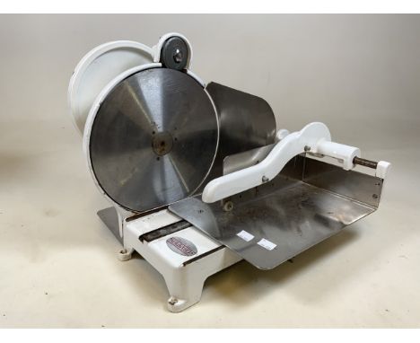 A heavy enamel butcher meat slice by Champion.
