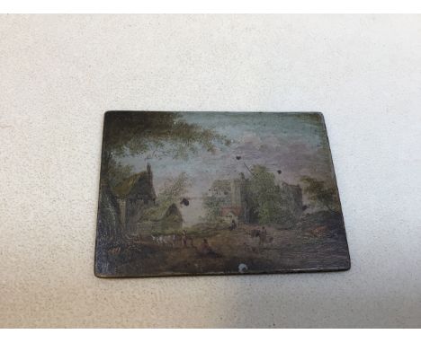 A small metal plaque with hand painted scene to front engraved to back in reverse - S Wests sale warehouse for unredeemed ple