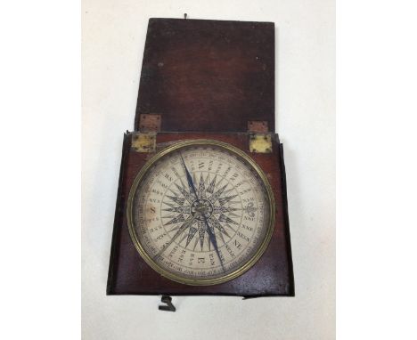 A boxed hand held 19th century compass. Wooden box with metal outer. Faintly marked to inside of lid Moore. Lid is detached f
