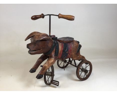 A vintage style toy pig tricycle. One stirrup missing H:50cm