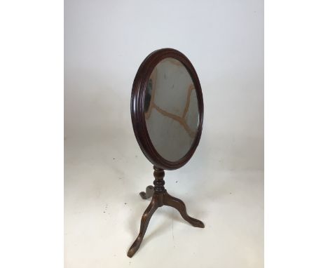 An antique mirror on tripod stand H:74cm