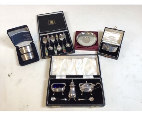 Hallmarked silver sets, 5 total including napkin rings, decorative spoons and a set of shakers. Good condition. Weight of sil