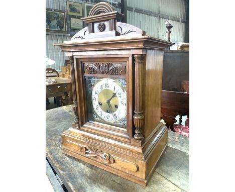A German Junghams bracket clock with bevelled glass and pendulum. 