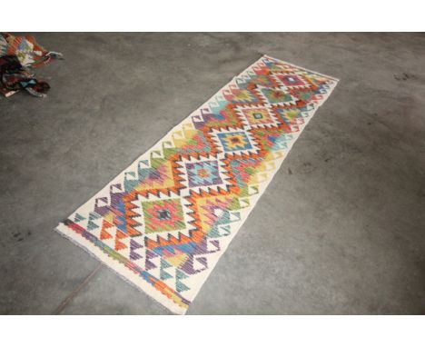 An approx. 6'7" x 2" Chobi Kilim runner