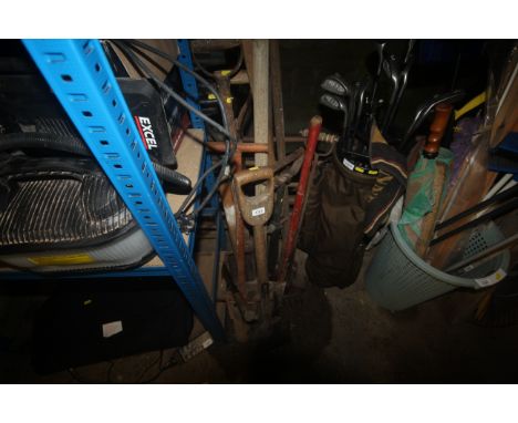 A quantity of various gardening tools to include, a spade, rake, hoe, stirrup pump etc.