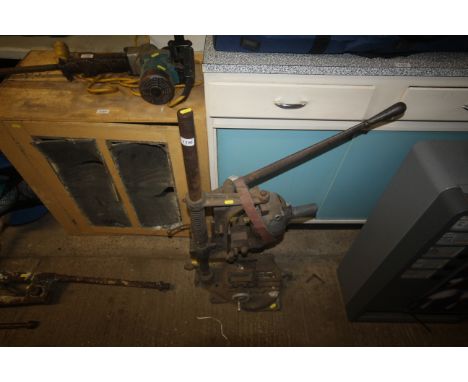 A vintage heavy duty drill press