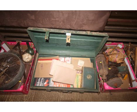 A painted dome topped metal chest containing a quantity of various hardback and paperback books, engineers tools etc.