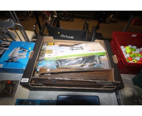A box containing various items to include a brass letterbox; a TV wall mount; various door furniture; two boxes of socket swi