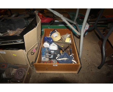A box containing various tools to include respirators, hand saw, masking tape, a Record number 51 junior bench vice etc.