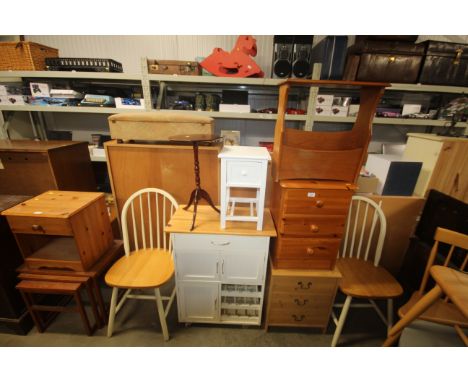 A pine bedside chest fitted three drawers, another similar, a teak magazine rack, a part painted pine kitchen trolley, a beds