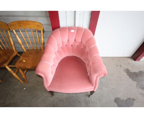 A button back upholstered armchair